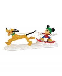 Mush mush, woof woof. Mickey Mouse catches some air on his snowboard as lovable Pluto races through the snow in this adorable Mickey's Village figurine from Department 56. Mush mush, woof woof. Mickey Mouse catches some air on his snowboard as lovable Pluto races through the snow in this adorable Mickey's Village figurine from Department 56.