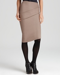 A careerist essential goes contemporary chic as subtle ruching and asymmetric tailoring inspire this Halston Heritage pencil skirt.