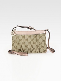 Signature GG jacquard, softly-pleated and trimmed with rich leather.Adjustable shoulder strap, 21-22 dropTop zip closureHeart key-chainFully lined7W X 4½H X 1DMade in Italy Signature GG jacquard, softly-pleated and trimmed with rich leather.Adjustable shoulder strap, 21-22 dropTop zip closureHeart key-chainFully lined7W X 4½H X 1DMade in Italy