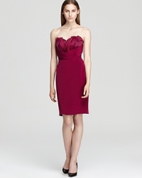Elaborate pleating decorates the bust of Jay Godfrey's Bailey dress, rendered in a rich jewel tone hue. Elaborate pleating decorates the bust of Jay Godfrey's Bailey dress, rendered in a rich jewel tone hue.