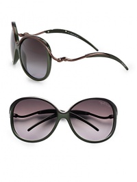 Feminine style with metal accented temples, top rim and bridge on a lightweight, acetate frame. Available in green/brown with smoke gradient lens. Logo etched lens100% UV protectionMade in Italy Feminine style with metal accented temples, top rim and bridge on a lightweight, acetate frame. Available in green/brown with smoke gradient lens. Logo etched lens100% UV protectionMade in Italy