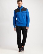 A sporty sweater is rendered in cozy wool with a buttoned mockneck for versatile styling.Four-button placketStand collarButtoned chest flap pocketRibbed knit collar, cuffs and hemWoolDry cleanImported