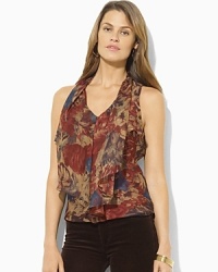 A muted floral pattern and flowing georgette construction combine to create a feminine blouse with fluttering ruffles at the front. A muted floral pattern and flowing georgette construction combine to create a feminine blouse with fluttering ruffles at the front.