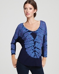 An electric tie-dye print enlivens this C&C California top, rendered in a flattering dolman-sleeve design. An electric tie-dye print enlivens this C&C California top, rendered in a flattering dolman-sleeve design.