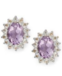 Enhance your look with bold flecks of color. Victoria Townsend's pretty stud earrings feature oval-cut amethyst (2-1/2 ct. t.w.) encircled by round-cut white topaz (1-1/20 ct. t.w.). Set in 18k gold over sterling silver. Approximate diameter: 1/2 inch. Enhance your look with bold flecks of color. Victoria Townsend's pretty stud earrings feature oval-cut amethyst (2-1/2 ct. t.w.) encircled by round-cut white topaz (1-1/20 ct. t.w.). Set in 18k gold over sterling silver. Approximate diameter: 1/2 inch.
