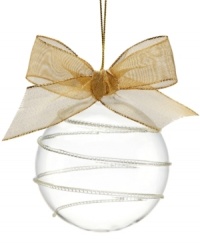 Give it a swirl. Simple yet chic, this Blow Glass Ball embodies a look of pure clarity with a whimsical swirl embellishment for a lovely presentation. With gold bow and hanging thread. Give it a swirl. Simple yet chic, this Blow Glass Ball embodies a look of pure clarity with a whimsical swirl embellishment for a lovely presentation. With gold bow and hanging thread.