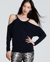 Revealing shoulder cut-outs and bullish metal accents inject this MICHAEL Michael Kors shirt with a dose of provocative edge. Pair with printed pants and send your style into overdrive. Revealing shoulder cut-outs and bullish metal accents inject this MICHAEL Michael Kors shirt with a dose of provocative edge. Pair with printed pants and send your style into overdrive.