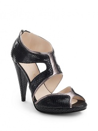 THE LOOKPeep toePython-embossed leather with contrasting metallic leather insertsGeometric cutout detailsBack zipperPadded insoleTHE FITSelf-covered wedge 4 (100mm)Self-covered platform, ½ (15mm)Compares to a 3½ heel (90mm)THE MATERIALPython-embossed & metallic leather upperLeather lining and soleORIGINMade in Italy THE LOOKPeep toePython-embossed leather with contrasting metallic leather insertsGeometric cutout detailsBack zipperPadded insoleTHE FITSelf-covered wedge 4 (100mm)Self-covered platform, ½ (15mm)Compares to a 3½ heel (90mm)THE MATERIALPython-embossed & metallic leather upperLeather lining and soleORIGINMade in Italy