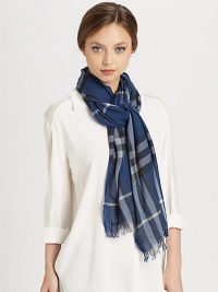 A bold check design with fringe trim on a crinkled cashmere and wool blend.55% merino wool/45% cashmere17.7 X 78.7Dry cleanMade in the United Kingdom A bold check design with fringe trim on a crinkled cashmere and wool blend.55% merino wool/45% cashmere17.7 X 78.7Dry cleanMade in the United Kingdom