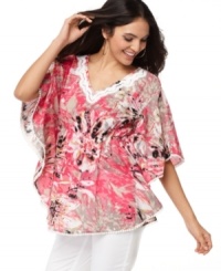 A vibrant print wakes up this fluid, relaxed tunic from Style&co. Lace trim adds a charming touch! A vibrant print wakes up this fluid, relaxed tunic from Style&co. Lace trim adds a charming touch!