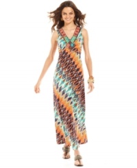 Festive beads and a colorful tribal print turn this fluid NY Collection maxi dress into a seasonal statement piece. When you're not going barefoot on the beach, statement sandals finish the look in style. Festive beads and a colorful tribal print turn this fluid NY Collection maxi dress into a seasonal statement piece. When you're not going barefoot on the beach, statement sandals finish the look in style.
