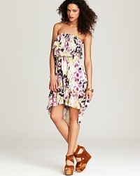 Painterly florals and sprightly ruffles give this Sweet Pea dress a pop of personality just in time for spring's awakening. Painterly florals and sprightly ruffles give this Sweet Pea dress a pop of personality just in time for spring's awakening.