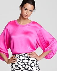 Billowing silk takes on a vivid hue in this ultra-femme Nanette Lepore top. Pair with print for added pop. Billowing silk takes on a vivid hue in this ultra-femme Nanette Lepore top. Pair with print for added pop.