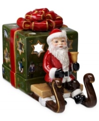 Santa Claus carries a brilliant surprise on the back of his sleigh in this beautifully crafted candle holder from Villeroy & Boch. Light shines through pierced stars in a present wrapped in charming vintage style. Santa Claus carries a brilliant surprise on the back of his sleigh in this beautifully crafted candle holder from Villeroy & Boch. Light shines through pierced stars in a present wrapped in charming vintage style.