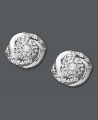 Add a special touch to any look. These subtly-shimmering studs by Wrapped in Love™ feature swirls of round-cut diamonds (1/4 ct. t.w.) set in polished sterling silver. Approximate diameter: 4/10 inch. Add a special touch to any look. These subtly-shimmering studs by Wrapped in Love™ feature swirls of round-cut diamonds (1/4 ct. t.w.) set in polished sterling silver. Approximate diameter: 4/10 inch.