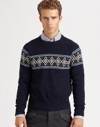 A modern style Nordic print pattern defines the body and shoulders of a cozy sweater knitted in superior wool.CrewneckRibbed knit collar, cuffs and hemWoolDry cleanImported