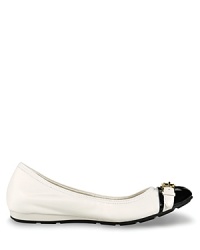 Buckled down elegance in a ballet flat with cap toe detail. From Cole Haan. Buckled down elegance in a ballet flat with cap toe detail. From Cole Haan.