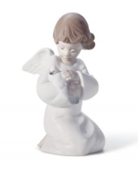 An angel holds in its lap a dove, the symbol of peace. Crafted by Lladró, Spain's most esteemed artisans of porcelain figurines. An angel holds in its lap a dove, the symbol of peace. Crafted by Lladró, Spain's most esteemed artisans of porcelain figurines.