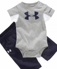 Get his geared up in sporty style with this cute bodysuit and pants set by Under Armour. Get his geared up in sporty style with this cute bodysuit and pants set by Under Armour.