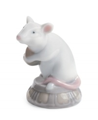 The kind of mouse you want in your house, this Lladro figurine is delicately glazed with a cute pink nose and shiny white fur in fine porcelain. The kind of mouse you want in your house, this Lladro figurine is delicately glazed with a cute pink nose and shiny white fur in fine porcelain.