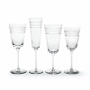 Kate Spade and Lenox join together to bring ease, elegance and understated wit to the table. Library Stripe Stemware features frosted stripes on tall, elegant stems. Shown from left to right: goblet, flute, iced beverage, wine glass. Coordinates perfectly with the Library Stripe Dinnerware.