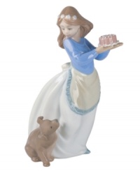 An adorably curious pup looks forward to his own celebration in this charming handmade figurine from Lladró. An adorably curious pup looks forward to his own celebration in this charming handmade figurine from Lladró.