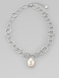 A large, lustrous white pearl drop dangles with creamy iridescence from a silvery chain of hammered open links. 22mm white baroque organic man-made pearl Rhodium-plated sterling silver Length, about 16, with 2 extender Lobster clasp Made in Spain A large, lustrous white pearl drop dangles with creamy iridescence from a silvery chain of hammered open links. 22mm white baroque organic man-made pearl Rhodium-plated sterling silver Length, about 16, with 2 extender Lobster clasp Made in Spain