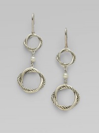 From the Infinity Collection. Two graceful circles, each formed of interwoven strands of smooth and cabled sterling silver, are connected by tiny freshwater pearls in these elegant drops. White freshwater pearls Sterling silver Drop, about 1¾ Ear wire Made in USA