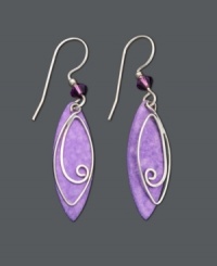Make a pristine statement in purple. These delicate drop earrings by Jody Coyote feature purple patina brass leaves with an intricate wire charm in sterling silver and purple glass bead accents. Set in sterling silver. Approximate drop: 1-3/4 inches. Make a pristine statement in purple. These delicate drop earrings by Jody Coyote feature purple patina brass leaves with an intricate wire charm in sterling silver and purple glass bead accents. Set in sterling silver. Approximate drop: 1-3/4 inches.