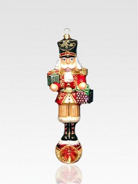 An exquisite ornament created by skilled artisans who capture all the traditional charm of a holiday nutcracker in a delicate, timeless glass design. Painted, glittered glass 7 high Made in Poland An exquisite ornament created by skilled artisans who capture all the traditional charm of a holiday nutcracker in a delicate, timeless glass design. Painted, glittered glass 7 high Made in Poland