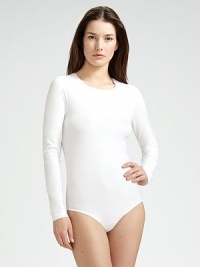 This seamless bodysuit fits like a second skin, in a soft, cotton-rich knit that's so comfortable when traveling. Crewneck Long sleeves Back thong coverage Cotton/nylon/elastene; dry clean Made in Austria