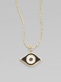 This protective evil eye, strung from a 14k yellow gold chain, is richly punctuated by a black diamond. Diamond, 0.2 tcw Enamel 14k yellow gold Chain length, about 16 Pendant width, about ½ Claw clasp Made in USA 