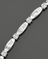 Supreme elegance. A breathtaking round-cut and baguette-cut diamond bracelet (2 ct. t.w.) set in 14k white gold. Length measures 7-1/4 inches.