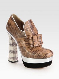 A bow and metallic trim complete this reptile-embossed calfskin silhouette, resting on a two-tone patent leather platform. Leather-covered heel, 5½ (140mm)Metallic and patent leather platform, 1¾ (45mm)Compares to a 3¾ heel (95mm)Embossed-leather upper with metallic patent leather trimLeather lining and solePadded insoleMade in Italy A bow and metallic trim complete this reptile-embossed calfskin silhouette, resting on a two-tone patent leather platform. Leather-covered heel, 5½ (140mm)Metallic and patent leather platform, 1¾ (45mm)Compares to a 3¾ heel (95mm)Embossed-leather upper with metallic patent leather trimLeather lining and solePadded insoleMade in Italy