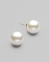 Simple and lovely, classic studs of lustrous white pearls to wear anywhere. 12mm organic man-made pearls 14k gold 14k gold post back Made in Spain