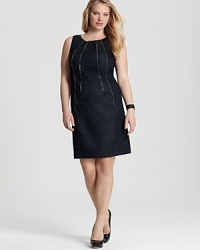 Brimming with urban attitude, this Calvin Klein sheath pairs a crisp silhouette with bullish zipper detailing. Team with gold accents for a tough take on glamour. Brimming with urban attitude, this Calvin Klein sheath pairs a crisp silhouette with bullish zipper detailing. Team with gold accents for a tough take on glamour.