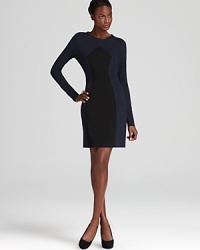 ABS by Allen Schwartz's fitted sweater dress lends a forward look with faux leather detailing and a two-tone design. ABS by Allen Schwartz's fitted sweater dress lends a forward look with faux leather detailing and a two-tone design.