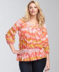 Fly away to a more fashionable place on the butterfly-wing print of INC's plus size peasant top. A peplum hem adds an on-trend touch. Fly away to a more fashionable place on the butterfly-wing print of INC's plus size peasant top. A peplum hem adds an on-trend touch.