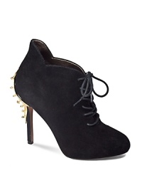 A studded gold-tone plate gives Sam Edelman's basic black suede lace-up bootie edge. A studded gold-tone plate gives Sam Edelman's basic black suede lace-up bootie edge.