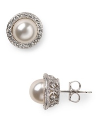 Silver set crystals surround lustrous simulated 8mm pearls to create a simply elegant silhouette. Wear this pair of Nadri stud earrings for have-forever glamour. Silver set crystals surround lustrous simulated 8mm pearls to create a simply elegant silhouette. Wear this pair of Nadri stud earrings for have-forever glamour.