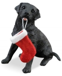 A fetching gift for animal lovers, the black lab Christmas ornament depicts an adorable pup sitting obediently, ready to hang his holiday stocking. From Sandicast. A fetching gift for animal lovers, the black lab Christmas ornament depicts an adorable pup sitting obediently, ready to hang his holiday stocking. From Sandicast.