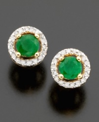 Pretty round-cut emeralds (1/2 ct. t.w.) are dressed to impress in these stud earrings featuring a beautiful setting of 14k gold & round-cut diamonds (1/10 ct. t.w.).