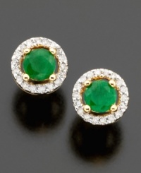 Pretty round-cut emeralds (1/2 ct. t.w.) are dressed to impress in these stud earrings featuring a beautiful setting of 14k gold & round-cut diamonds (1/10 ct. t.w.). Pretty round-cut emeralds (1/2 ct. t.w.) are dressed to impress in these stud earrings featuring a beautiful setting of 14k gold & round-cut diamonds (1/10 ct. t.w.).