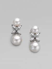 A radiant pairing of organic white pearls with sparkling cubic zirconia X-shaped accents. 12mm man-made pearls Cubic zirconia Rhodium-plated sterling silver Drop, about 1 Post-and-hinge back Imported A radiant pairing of organic white pearls with sparkling cubic zirconia X-shaped accents. 12mm man-made pearls Cubic zirconia Rhodium-plated sterling silver Drop, about 1 Post-and-hinge back Imported