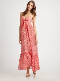 A pretty floral coverup made with a flattering silhouette and relaxed fit offering chic comfort.Bandeau topSelf-tie detail at bustSpaghetti strapsFunctional side buttonsRuffle hem70% cotton/30% silkDry cleanMade in USA of imported fabric A pretty floral coverup made with a flattering silhouette and relaxed fit offering chic comfort.Bandeau topSelf-tie detail at bustSpaghetti strapsFunctional side buttonsRuffle hem70% cotton/30% silkDry cleanMade in USA of imported fabric
