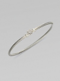 From the Cable Collectibles Collection. Thin sterling silver band with delicate diamond pavé heart.Diamond, 0.11 tcw Sterling silver Width, about 3mm Hook closure Imported From the Cable Collectibles Collection. Thin sterling silver band with delicate diamond pavé heart.Diamond, 0.11 tcw Sterling silver Width, about 3mm Hook closure Imported