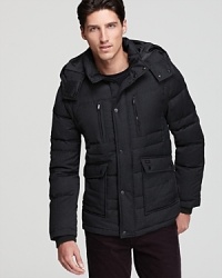 A high-performance coat from Tumi features down for warmth, the perfect antidote for that ever increasing wind chill factor. A high-performance coat from Tumi features down for warmth, the perfect antidote for that ever increasing wind chill factor.