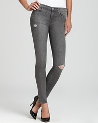Denim ventures into the grey zone with J Brand skinny jeans, fabricated in a foolproof light grey wash. Denim ventures into the grey zone with J Brand skinny jeans, fabricated in a foolproof light grey wash.