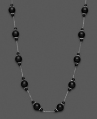 Mysterious loveliness. Show your dark side with this necklace with black onyx beads (4-10 mm). Set in sterling silver. Approximate length: 18 inches. Mysterious loveliness. Show your dark side with this necklace with black onyx beads (4-10 mm). Set in sterling silver. Approximate length: 18 inches.