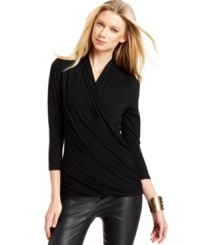 Vince Camuto's top features a flattering faux-wrap silhouette that looks flawless with pants and skirts. Vince Camuto's top features a flattering faux-wrap silhouette that looks flawless with pants and skirts.